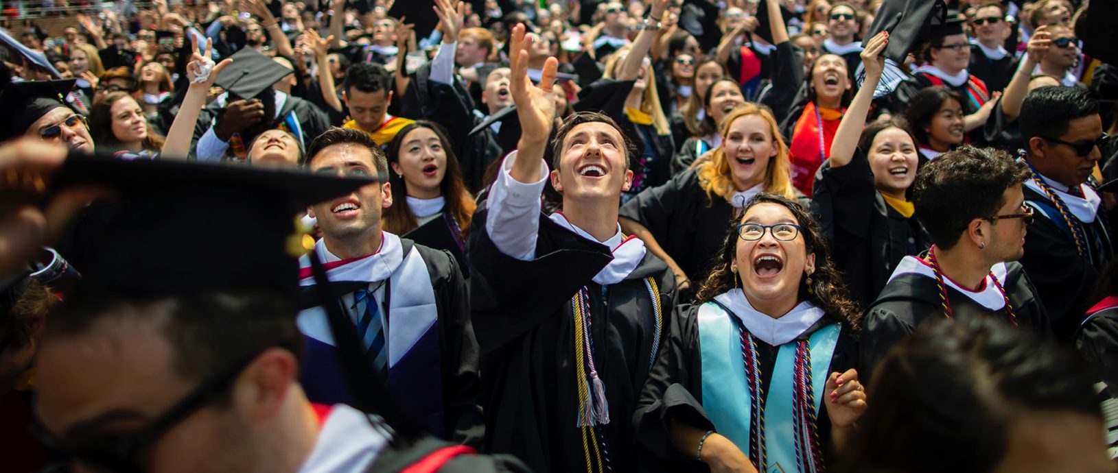 Graduation cap toss at commencement