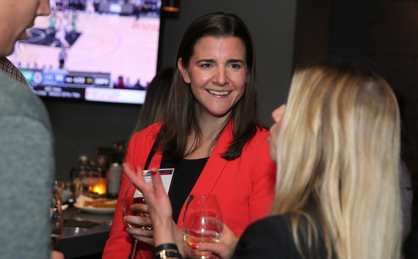 Woman smiling at Young Alumni event