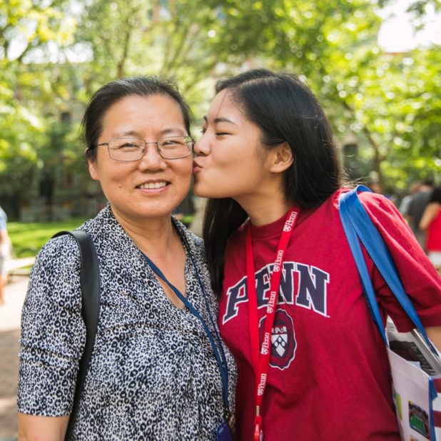 Daughter kissing mother's cheek